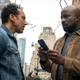 Ben, Mike, and one of their all-important co-stars: a phone!